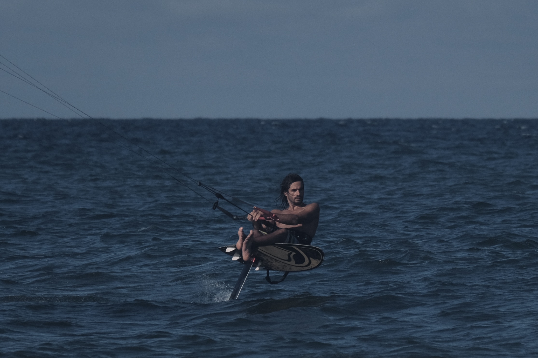 Foiling sitting style on the water