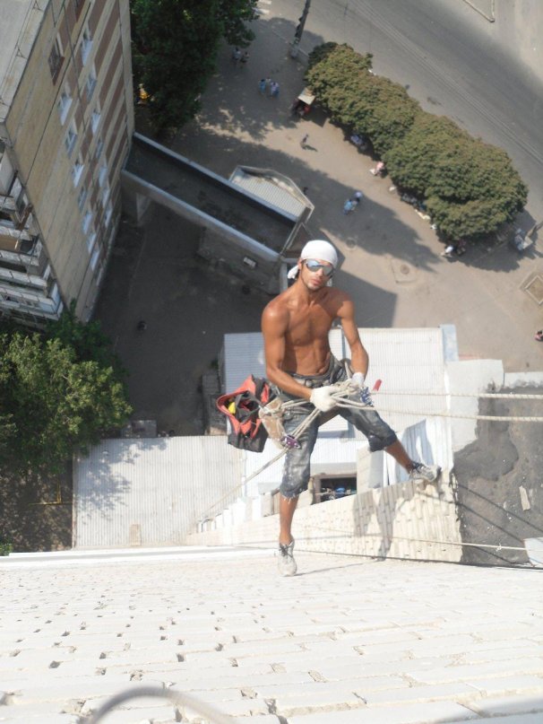 Viktor doing rope access work on a high-rise building