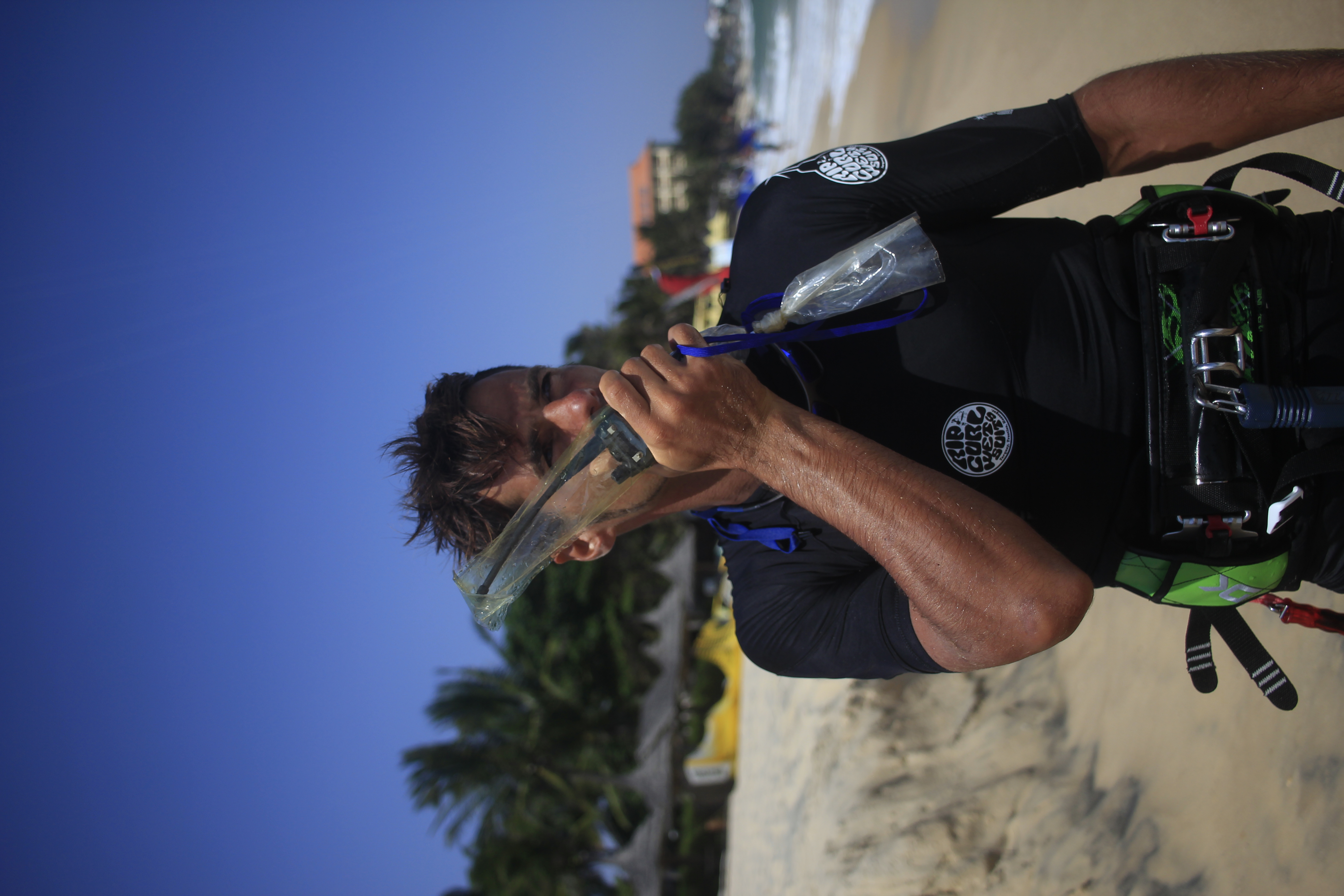 Viktor teaching with a radio on the beach