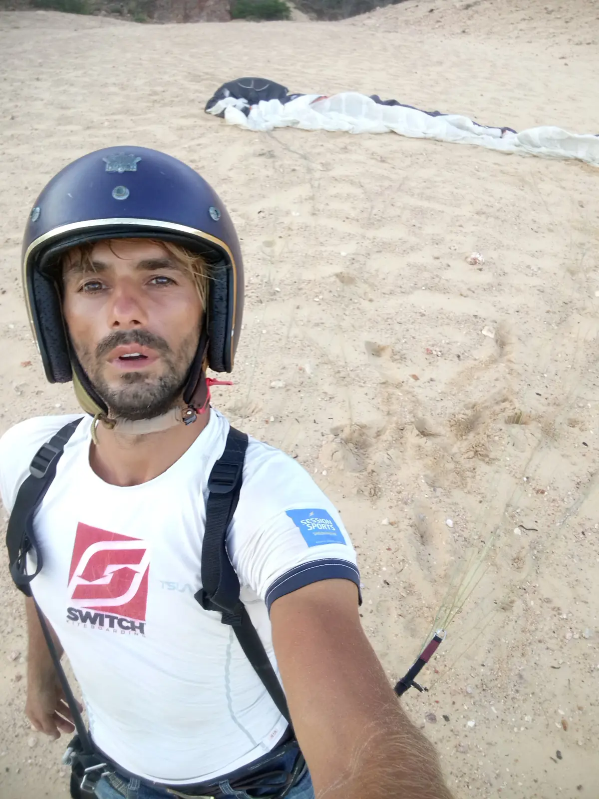 Viktor in paragliding gear before flight