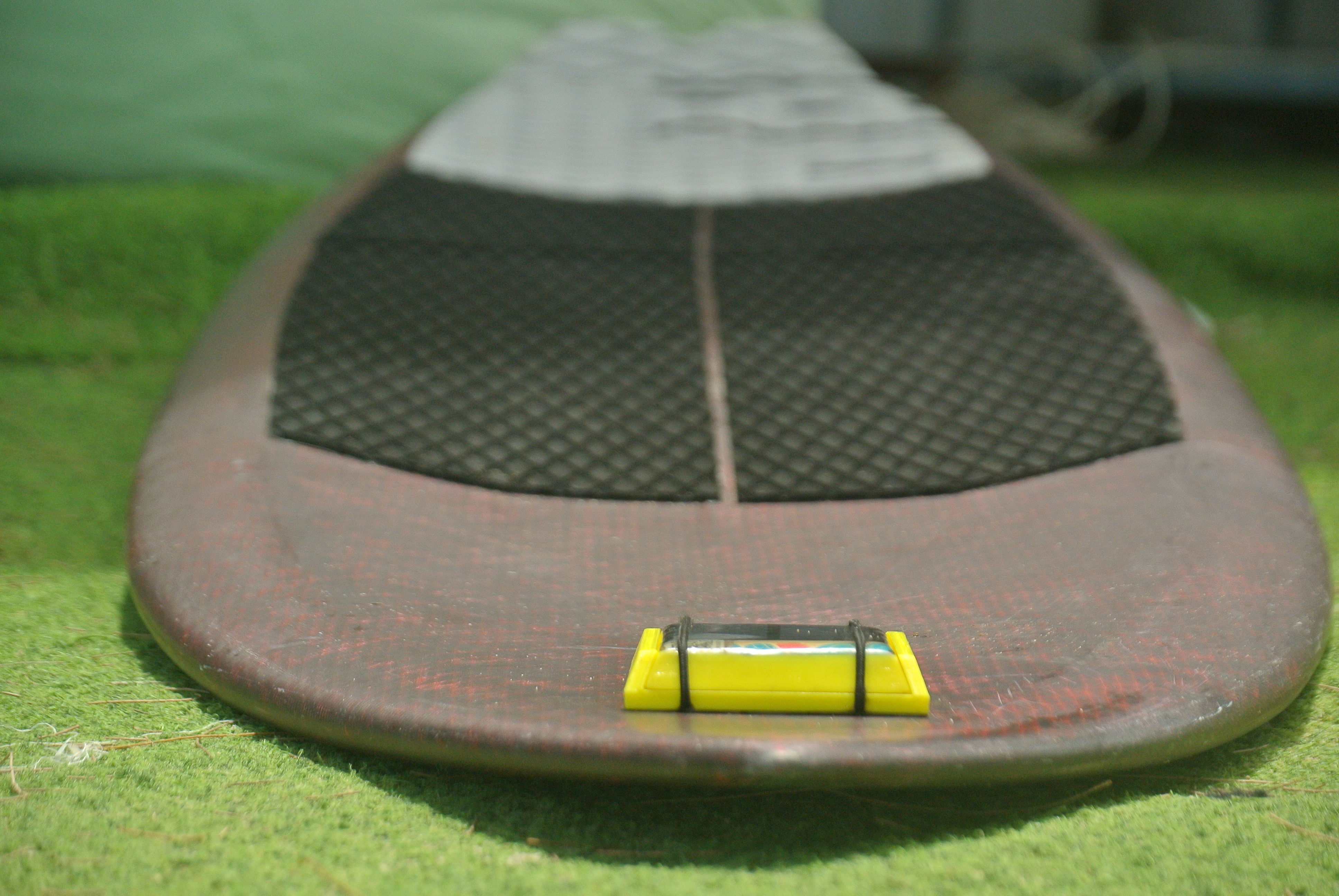 SmartSurf tracker on a surfboard